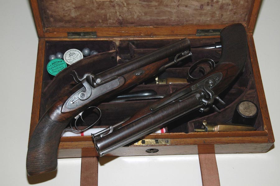 A fine pair of full sidelock .68 caliber (14 bore) double-barrel pistols ma...